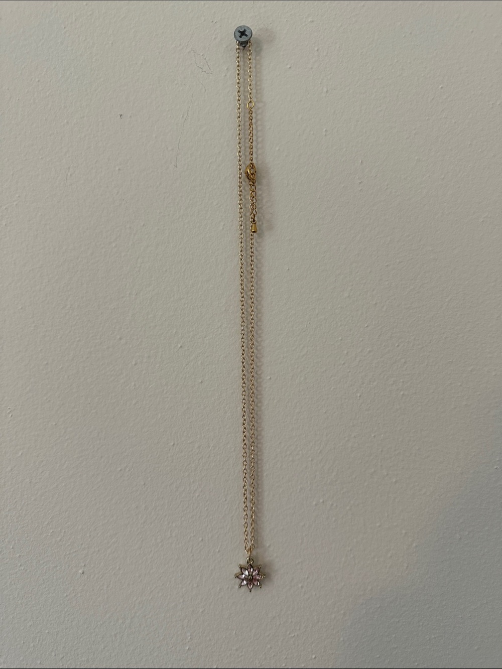 Gold Starburst Pendant Necklace with Pink Gemstone